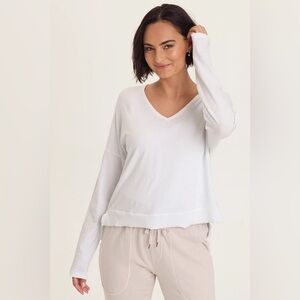 WEARABLES
ODILIA HIGH-LOW LONG SLEEVE V-NECK TOP
 In White
